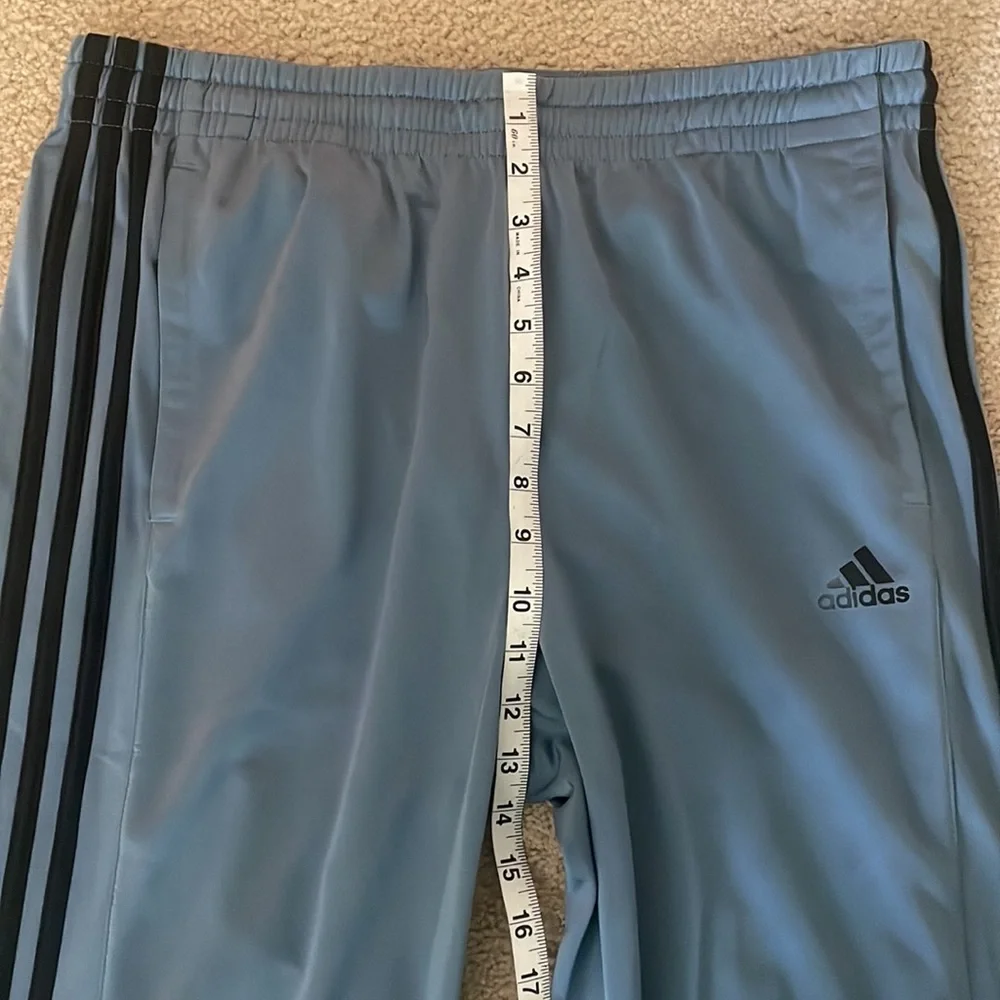 Adidas Men’s Joggers. Blue/grey color with black stripes.